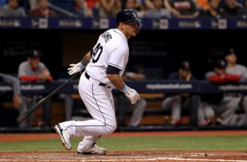 ST PETERSBURG, FL – MAY 24: Wilson Ramos #40 of the Tampa Bay Rays hits a three-RBI single in the second inning during a game against the Boston Red Sox at Tropicana Field on May 24, 2018, in St Petersburg, Florida. (Photo by Mike Ehrmann/Getty Images)