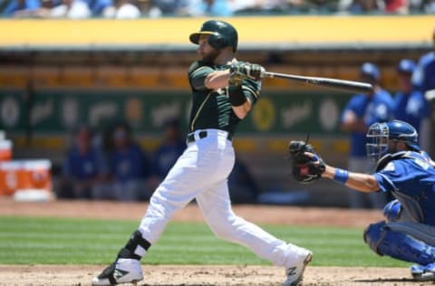 OAKLAND, CA – JUNE 10: Jonathan Lucroy #21 of the Oakland Athletics hits an rbi single scoring Mark Canha #20 against the Kansas City Royals in the bottom of the second inning at the Oakland Alameda Coliseum on June 10, 2018, in Oakland, California. (Photo by Thearon W. Henderson/Getty Images)