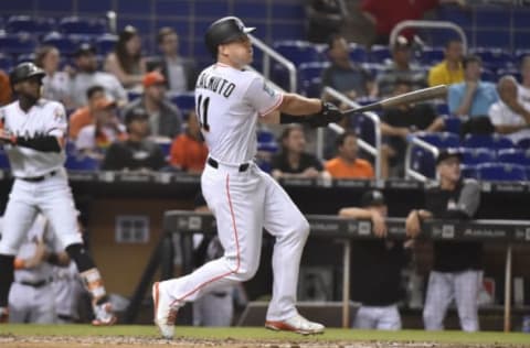 MIAMI, FL – JUNE 11: J.T. Realmuto #11 of the Miami Marlins hits a home run in the seventh inning against the San Francisco Giants at Marlins Park on June 11, 2018, in Miami, Florida. (Photo by Eric Espada/Getty Images)