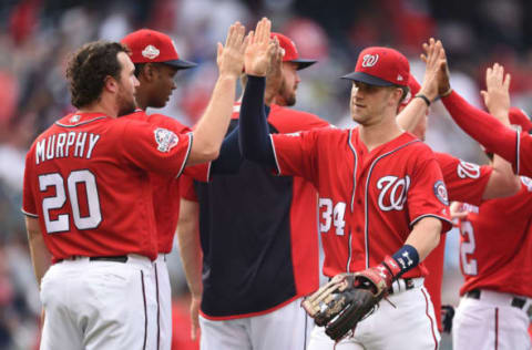 JUNE 18 – WASHINGTON: Bryce Harper of the Washington Nationals celebrates a win with Daniel Murphy #20 after game one of a doubleheader against the New Yankees at Nats Park on 18th June in Washington. Game one is the completion of a game that was suspended on May 15th due to rain. (Photo by Mitchell Layton/Getty Images)