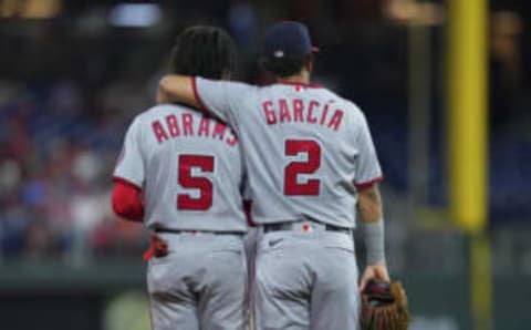 PHILADELPHIA, PA – SEPTEMBER 09: Luis Garcia #2 of the Washington Nationals puts his arm around CJ Abrams #5 against the Philadelphia Phillies at Citizens Bank Park on September 9, 2022 in Philadelphia, Pennsylvania. The Phillies defeated the Nationals 5-3. (Photo by Mitchell Leff/Getty Images)