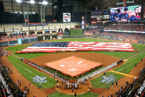 HOUSTON, TEXAS – OCTOBER 22: An American flag is displayed as singer-songwriter Nicole Scherzinger performs the national anthem prior to Game One of the 2019 World Series between the Houston Astros and the Washington Nationals at Minute Maid Park on October 22, 2019 in Houston, Texas. (Photo by Bob Levey/Getty Images)