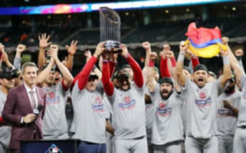 HOUSTON, TEXAS – OCTOBER 30: Manager Dave Martinez #4 of the Washington Nationals hoists the Commissioners Trophy after defeating the Houston Astros 6-2 in Game Seven to win the 2019 World Series in Game Seven of the 2019 World Series at Minute Maid Park on October 30, 2019 in Houston, Texas. (Photo by Elsa/Getty Images)