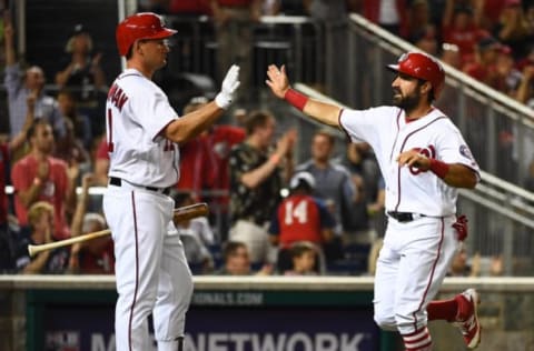 Apr 11, 2017; Washington, DC, USA; Washington Nationals center fielder Adam Eaton (2) is congratulated by first baseman Ryan Zimmerman (11) after scoring a run against the St. Louis Cardinals during the third inning at Nationals Park. Mandatory Credit: Brad Mills-USA TODAY Sports