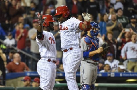 Apr 12, 2017; Philadelphia, PA, USA; Philadelphia Phillies third baseman Maikel Franco (7) celebrates his grand slam home run with center fielder Odubel Herrera (37) during the sixth inning against the New York Mets at Citizens Bank Park. The Mets won the game 5-4. Mandatory Credit: John Geliebter-USA TODAY Sports