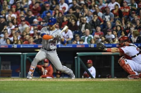 Apr 12, 2017; Philadelphia, PA, USA; New York Mets left fielder Michael Conforto (30) takes a walk to load the bases in the fifth inning against the Philadelphia Phillies at Citizens Bank Park. The Mets won the game 5-4. Mandatory Credit: John Geliebter-USA TODAY Sports