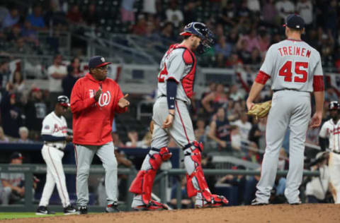 Apr 18, 2017; Atlanta, GA, USA; Washington Nationals manager Dusty Baker (12) removes relief pitcher Blake Treinen (45) from the mound in the ninth inning against the Atlanta Braves at SunTrust Park. Also pictured is Nationals catcher Matt Wieters (32). The Nationals won 3-1. Mandatory Credit: Jason Getz-USA TODAY Sports