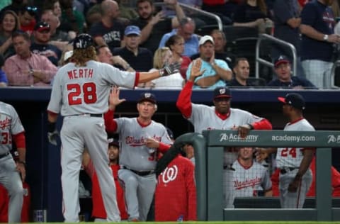 Apr 19, 2017; Atlanta, GA, USA; Washington Nationals left fielder Jayson Werth (28) celebrates his run with manager Dusty Baker (12) on a single by center fielder Adam Eaton (not pictured) in the second inning of their game against the Atlanta Braves at SunTrust Park. Mandatory Credit: Jason Getz-USA TODAY Sports