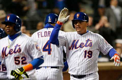 Apr 19, 2017; New York City, NY, USA; New York Mets right fielder Jay Bruce (19) walks to the dugout after his second home run of the night against the Philadelphia Phillies at Citi Field. Mandatory Credit: Noah K. Murray-USA TODAY Sports