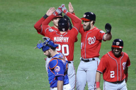 Apr 23, 2017; New York City, NY, USA; Washington Nationals second baseman Daniel Murphy (20) celebrates with teammates after hitting a grand slam to center during the first inning against the New York Mets at Citi Field. Mandatory Credit: Anthony Gruppuso-USA TODAY Sports