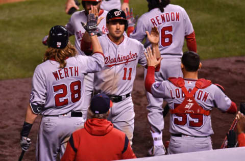 Apr 26, 2017; Denver, CO, USA; Washington Nationals first baseman Ryan Zimmerman (11) celebrates scoring a run with left fielder Jayson Werth (28) and catcher Jose Lobaton (59) in the seventh inning against the Colorado Rockies at Coors Field. Mandatory Credit: Ron Chenoy-USA TODAY Sports