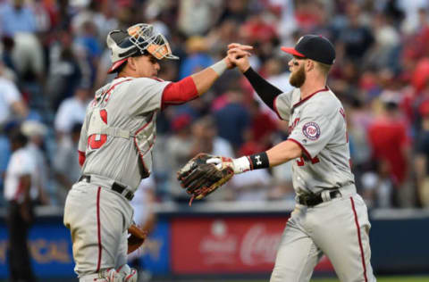 Apr 4, 2016; Atlanta, GA, USA; Washington Nationals catcher Wilson Ramos (40) and right fielder Bryce Harper (34) react after defeating the Atlanta Braves at Turner Field. The Nationals defeated the Braves 4-3 in ten innings. Mandatory Credit: Dale Zanine-USA TODAY Sports