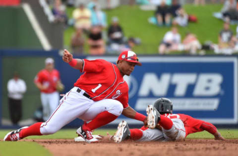 Mar 7, 2017; West Palm Beach, FL, USA; Boston Red Sox right fielder Mookie Betts (50) is tagged out by Washington Nationals second baseman Wilmer Difo (1) while attempting to steal second base at The Ballpark of the Palm Beaches. Mandatory Credit: Jasen Vinlove-USA TODAY Sports