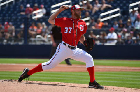 Mar 28, 2017; West Palm Beach, FL, USA; Washington Nationals first baseman Ryan Zimmerman (11) connects for a base hit during a spring training game against the Miami Marlins at The Ballpark of the Palm Beaches. Mandatory Credit: Steve Mitchell-USA TODAY Sports