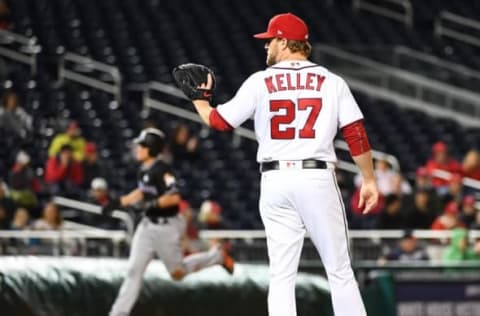 Apr 6, 2017; Washington, DC, USA; Washington Nationals relief pitcher Shawn Kelley (27) reacts after giving up a two run homer to Miami Marlins catcher J.T. Realmuto (left) during the eighth inning at Nationals Park. Mandatory Credit: Brad Mills-USA TODAY Sports