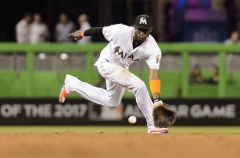 Sep 6, 2016; Miami, FL, USA; Miami Marlins shortstop Adeiny Hechavarria (3) is unable to field a ball during a game against the Philadelphia Phillies at Marlins Park. Mandatory Credit: Steve Mitchell-USA TODAY Sports