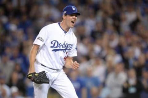 Oct 18, 2016; Los Angeles, CA, USA; Los Angeles Dodgers starting pitcher Rich Hill (44) reacts after a strike out during the sixth inning against the Chicago Cubs in game three of the 2016 NLCS playoff baseball series at Dodger Stadium. Mandatory Credit: Gary A. Vasquez-USA TODAY Sports