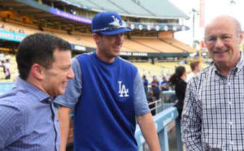 LOS ANGELES, CA – APRIL 28: Andrew Friedman, President of Baseball Operations, and Stan Kasten, President, and part-owner of the Los Angeles Dodgers talk with Cody Bellinger