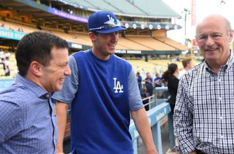 LOS ANGELES, CA – APRIL 28: Andrew Friedman, President of Baseball Operations, and Stan Kasten, President, and part-owner of the Los Angeles Dodgers talk with Cody Bellinger