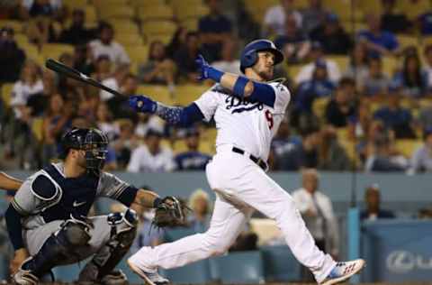 LOS ANGELES, CA – AUGUST 01: Yasmani Grandal #9 of the Los Angeles Dodgers hits a walk-off home run in the tenth inning of the MLB game against the Milwaukee Brewers at Dodger Stadium on August 1, 2018, in Los Angeles, California. The Dodgers defeated the Brewers 6-4. (Photo by Victor Decolongon/Getty Images)