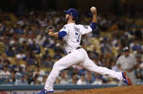 LOS ANGELES, CA – AUGUST 01: Relief pitcher Dylan Floro #51 of the Los Angeles Dodgers pitches in the tenth inning during the MLB game against the Milwaukee Brewers at Dodger Stadium on August 1, 2018 in Los Angeles, California. The Dodgers defeated the Brewers 6-4. (Photo by Victor Decolongon/Getty Images)