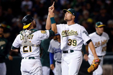 OAKLAND, CA – AUGUST 08: Blake Treinen #39 of the Oakland Athletics celebrates with Jonathan Lucroy #21 after the game against the Los Angeles Dodgers (Photo by Jason O. Watson/Getty Images)