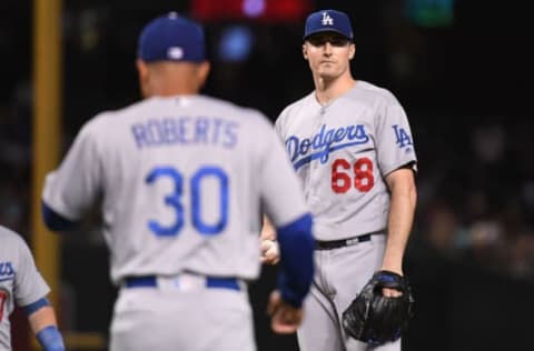 PHOENIX, AZ – SEPTEMBER 26: Ross Stripling #68 of the Los Angeles Dodgers reacts as manager Dave Roberts #30 approaches the mound to relieve him during the second inning of the MLB game against the Arizona Diamondbacks at Chase Field on September 26, 2018 in Phoenix, Arizona. (Photo by Jennifer Stewart/Getty Images)