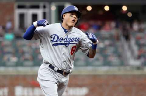 ATLANTA, GA – OCTOBER 08: Manny Machado #8 of the Los Angeles Dodgers celebrates as he rounds the bases after hitting a three run homerun during the seventh inning of Game Four of the National League Division Series against the Atlanta Braves at Turner Field on October 8, 2018 in Atlanta, Georgia. (Photo by Rob Carr/Getty Images)