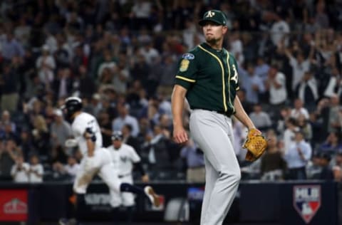 NEW YORK, NEW YORK – OCTOBER 03: Blake Treinen #39 of the Oakland Athletics looks on after giving up a solo home run to Giancarlo Stanton #27 of the New York Yankees in the eight inning during the American League Wild Card Game at Yankee Stadium on October 03, 2018 in the Bronx borough of New York City. (Photo by Al Bello/Getty Images)