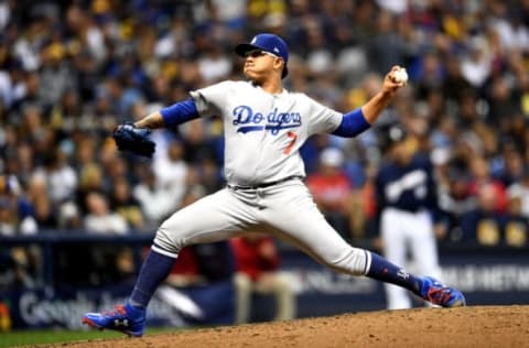 MILWAUKEE, WI – OCTOBER 12: Julio Urias #7 of the Los Angeles Dodgers throws a pitch against the Milwaukee Brewers during the seventh inning in Game One of the National League Championship Series at Miller Park on October 12, 2018 in Milwaukee, Wisconsin. (Photo by Stacy Revere/Getty Images)