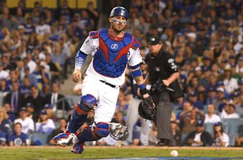 LOS ANGELES, CA – OCTOBER 15: Yasmani Grandal #9 of the Los Angeles Dodgers chases a wild pitch that allowed Travis Shaw #21 of the Milwaukee Brewers (not pictured) to score in the sixth inning in Game Three of the National League Championship Series at Dodger Stadium on October 15, 2018 in Los Angeles, California. (Photo by Harry How/Getty Images)