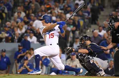 LOS ANGELES, CA – OCTOBER 16: Austin Barnes #15 of the Los Angeles Dodgers singles in the seventh inning against the Milwaukee Brewers in Game Four of the National League Championship Series at Dodger Stadium on October 16, 2018 in Los Angeles, California. (Photo by Harry How/Getty Images)