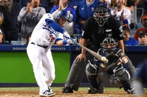 LOS ANGELES, CA – OCTOBER 16: Max Muncy #13 of the Los Angeles Dodgers singles in the eighth inning off Josh Hader #71 of the Milwaukee Brewers (not pictured) in Game Four of the National League Championship Series at Dodger Stadium on October 16, 2018 in Los Angeles, California. (Photo by Kevork Djansezian/Getty Images)