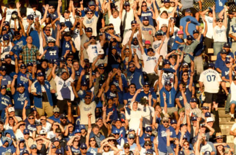 LOS ANGELES, CA – OCTOBER 17: Los Angeles Dodgers fans cheer during the eighth inning against the Milwaukee Brewers in Game Five of the National League Championship Series at Dodger Stadium on October 17, 2018 in Los Angeles, California. (Photo by Kevork Djansezian/Getty Images)