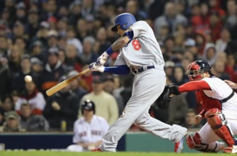 BOSTON, MA – OCTOBER 23: Manny Machado #8 of the Los Angeles Dodgers hits into an RBI fielders choice during the fifth inning against the Boston Red Sox in Game One of the 2018 World Series at Fenway Park on October 23, 2018 in Boston, Massachusetts. (Photo by Elsa/Getty Images)