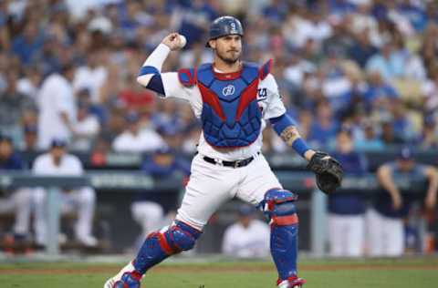 LOS ANGELES, CA – OCTOBER 26: Yasmani Grandal #9 of the Los Angeles Dodgers throws out the runner during the second inning against the Boston Red Sox in Game Three of the 2018 World Series at Dodger Stadium on October 26, 2018, in Los Angeles, California. (Photo by Ezra Shaw/Getty Images)