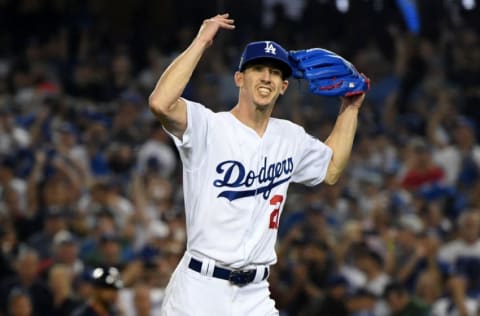 LOS ANGELES, CA - OCTOBER 26: Walker Buehler #21 of the Los Angeles Dodgers reacts after retiring the side on a strike out during the seventh inning against the Boston Red Sox in Game Three of the 2018 World Series at Dodger Stadium on October 26, 2018 in Los Angeles, California. (Photo by Harry How/Getty Images)