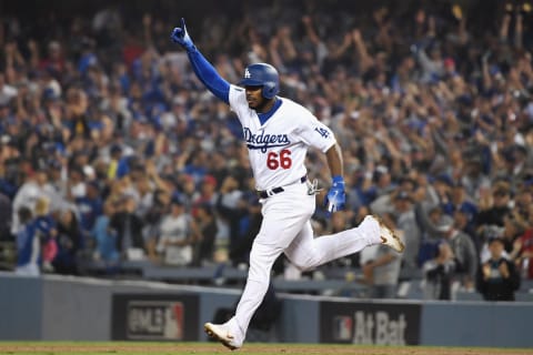 LOS ANGELES, CA – OCTOBER 27: Yasiel Puig #66 of the Los Angeles Dodgers celebrates after hitting a three-run home run to left field in the sixth inning of Game Four of the 2018 World Series against pitcher Eduardo Rodriguez #57 of the Boston Red Sox (not in photo) at Dodger Stadium on October 27, 2018 in Los Angeles, California. (Photo by Harry How/Getty Images)