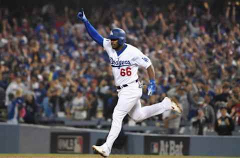 LOS ANGELES, CA – OCTOBER 27: Yasiel Puig #66 of the Los Angeles Dodgers celebrates after hitting a three-run home run to left field in the sixth inning of Game Four of the 2018 World Series against pitcher Eduardo Rodriguez #57 of the Boston Red Sox (not in photo) at Dodger Stadium on October 27, 2018 in Los Angeles, California. (Photo by Harry How/Getty Images)