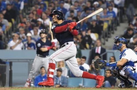 LOS ANGELES, CA – OCTOBER 28: Mookie Betts #50 of the Boston Red Sox hits a sixth inning home run against the Los Angeles Dodgers in Game Five of the 2018 World Series at Dodger Stadium on October 28, 2018 in Los Angeles, California. (Photo by Harry How/Getty Images)