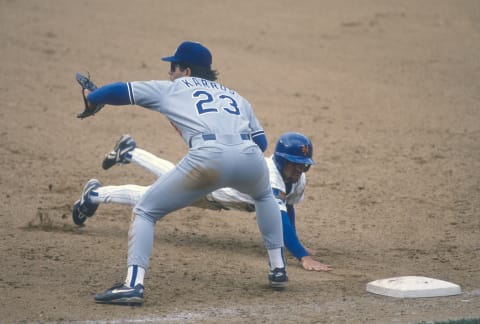 NEW YORK – CIRCA 1994: Eric Karros #23 of the Los Angeles Dodgers takes the throw over at first base against the New York Mets during a Major League Baseball game circa 1994 at Shea Stadium in the Queens borough of New York City. Karros played for the Dodgers in 1991-02. (Photo by Focus on Sport/Getty Images)