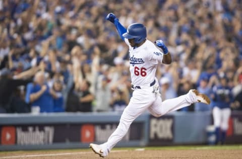 LOS ANGELES, CA - OCTOBER 27: Yasiel Puig #66 of the Los Angeles Dodgers reacts after hitting a three run home run during the sixth inning of game four of the 2018 World Series against the Boston Red Sox on October 27, 2018 at Dodger Stadium in Los Angeles, California. (Photo by Billie Weiss/Boston Red Sox/Getty Images)