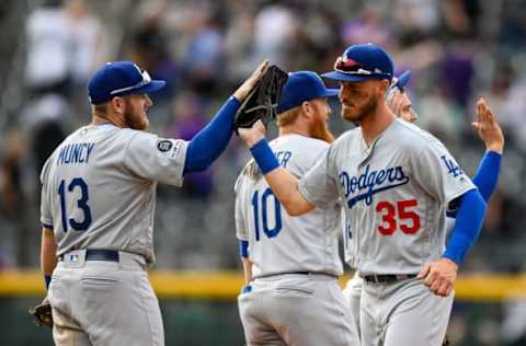 DENVER, CO – APRIL 5: Max Muncy #13 of the Los Angeles Dodgers and Cody Bellinger #35 celebrate after a 10-6 win over the Colorado Rockies during the Colorado Rockies home opener at Coors Field on April 5, 2019 in Denver, Colorado. (Photo by Dustin Bradford/Getty Images)