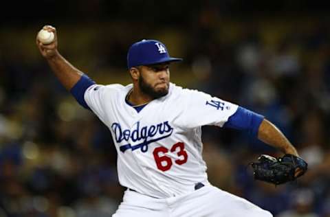 LOS ANGELES, CALIFORNIA – APRIL 02: Yimi Garcia #63 of the Los Angeles Dodgers delivers a pitch against the San Francisco Giants during the ninth inning at Dodger Stadium on April 02, 2019 in Los Angeles, California. (Photo by Yong Teck Lim/Getty Images)