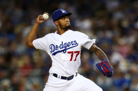 LOS ANGELES, CALIFORNIA – APRIL 13: Dennis Santana #77 of the Los Angeles Dodgers throws a pitch against the Milwaukee Brewers during the fifth inning at Dodger Stadium on April 13, 2019 in Los Angeles, California. (Photo by Yong Teck Lim/Getty Images)