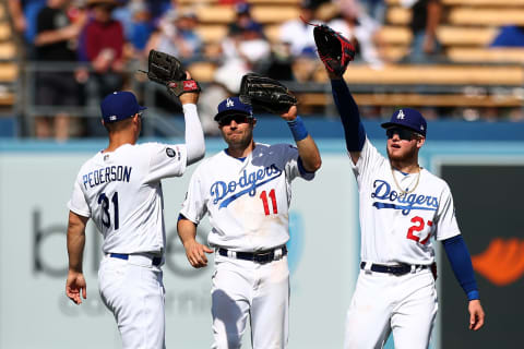 LOS ANGELES, CALIFORNIA – APRIL 14: Joc Pederson #31, A.J. Pollock #11 and Alex Verdugo #27 of the Los Angeles Dodgers celebrate their 7-1 victory against the Milwaukee Brewers at Dodger Stadium on April 14, 2019 in Los Angeles, California. (Photo by Yong Teck Lim/Getty Images)