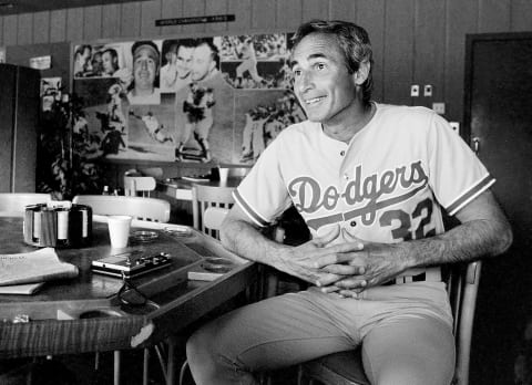 VERO BEACH, FL – 1981 : (EDITORS NOTE: Image has been shot in black and white. Color version not available.) Former pitcher Sandy Koufax of the Los Angeles Dodgers sits in the lounge during an interview at spring training in Vero Beach, Fl. (Photo by Jayne Kamin-Oncea/Getty Images)