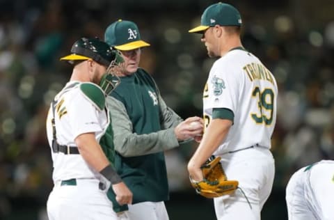 OAKLAND, CA – JULY 03: Manager Bob Melvin #6 of the Oakland Athletics take the ball from Blake Treinen #39 taking Treinen out of the game against the Minnesota Twins in the top of the 12th inning of a Major League Baseball game at Oakland-Alameda County Coliseum on July 3, 2019 in Oakland, California. (Photo by Thearon W. Henderson/Getty Images)