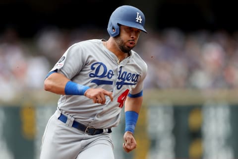 DENVER, COLORADO – JUNE 30: Edwin Rios #43 of the Los Angeles Dodgers runs to third base on a Russell Martin single in the sixth inning against the Colorado Rockies at Coors Field on June 30, 2019 in Denver, Colorado. (Photo by Matthew Stockman/Getty Images)