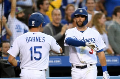 LOS ANGELES, CALIFORNIA – JULY 03: Austin Barnes #15 of the Los Angeles Dodgers celebrates his run with Chris Taylor #3, from a Joc Pederson #31 single, to take a 3-0 lead over the Arizona Diamondbacks, during the second inning at Dodger Stadium on July 03, 2019 in Los Angeles, California. (Photo by Harry How/Getty Images)